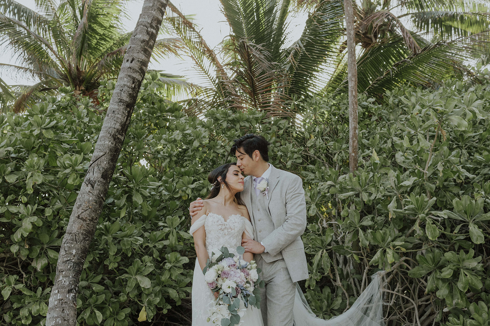 Couple at sunset on Grand Palladium Riviera Maya beach wedding