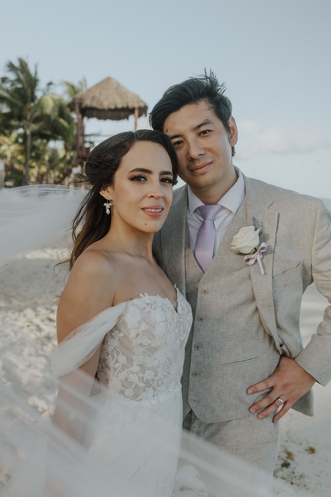 Couple at sunset on Grand Palladium Riviera Maya beach wedding