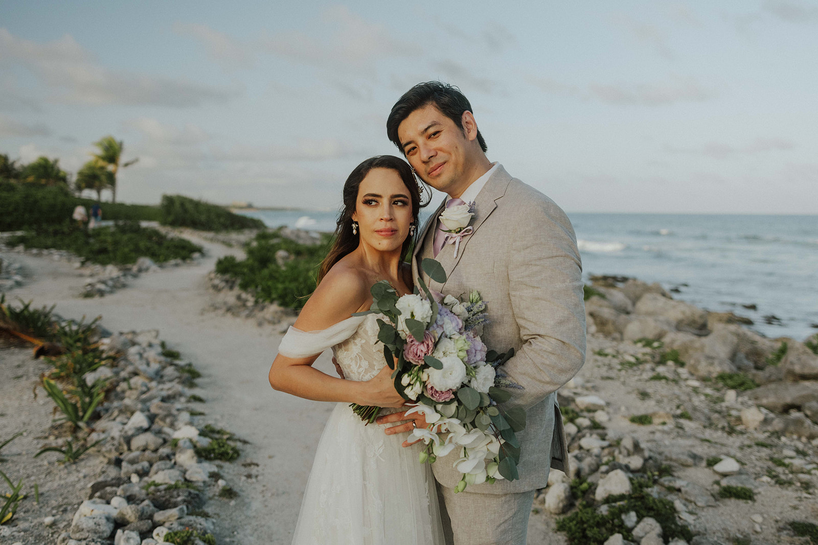 Couple at sunset on Grand Palladium Riviera Maya beach wedding