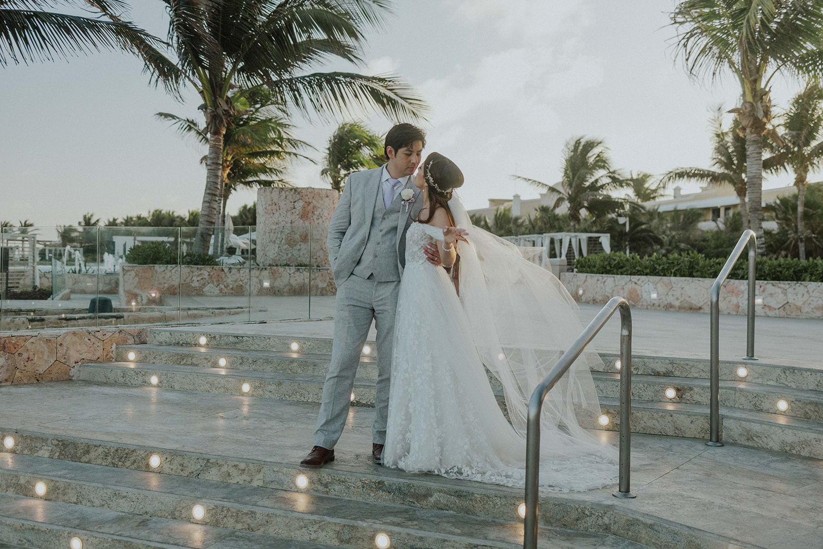 Couple at sunset on Grand Palladium Riviera Maya beach wedding